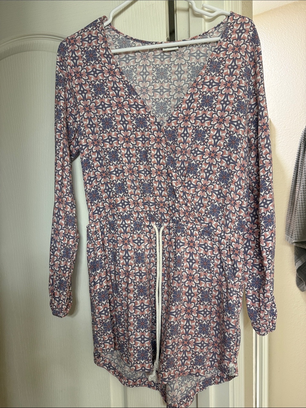 Rhythm Floral Print Long Sleeve Romper in Blue and Pink